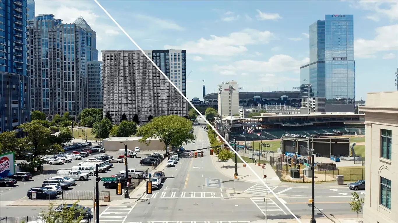 Composite aerial rendering showing a CGI building composited into a real drone photograph of the site
